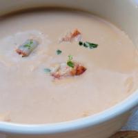 Lobster Coconut Bisque · Red curry, ginger, lemongrass,  veloute.