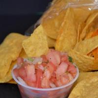 Chips And Salsa Roja* · Seasoned chips and 4oz Salsa