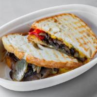 Vegan Portobello Cheese Steak · Vegan and organic. Marinated and shaved roasted portobello mushrooms with sautéed peppers an...