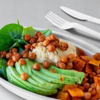 Vegan Bowl · Baby spinach, sweet potatoes, red quinoa, avocado, and hummus.