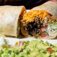Burrito · Stuffed with rice, Fried beans, Lettuce, Pico de gallo, Sour cream, Guacamole, and choice fr...