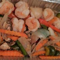 (63.) Tom Rang Man (Dinner) · Spicy. Spicy shrimp. Fresh shrimp sautéed with carrot, mushroom, onion, red bell pepper & sc...
