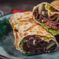 Gyro Wrap · Gyro meat, lettuce, tomatoes, red onions wrapped in lavash bread,minty cucumber- yogurt sauc...