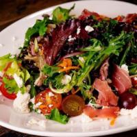 Georgetown Salad · Mesclun greens, tomatoes, carrots, red onion, grapes, feta cheese, raspberry vinaigrette