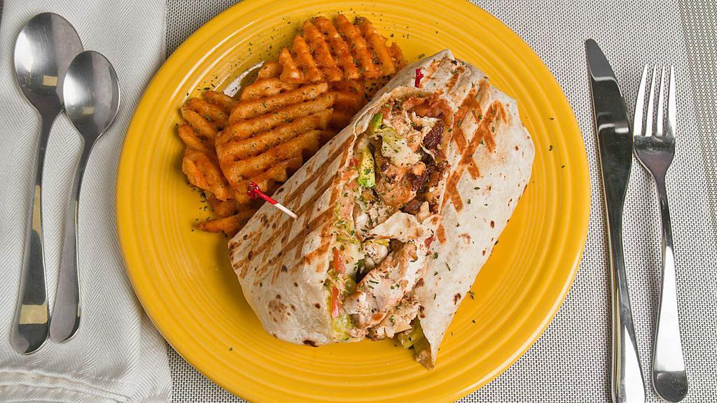 Chicken Avocado Wrap · Honey mustard, avocado, bacon, lettuce, tomatoes, and cucumber. Served with a bag of chips.