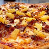 The Hawaiian Pizza · Tomato sauce, cheese blend, pepper ham, crisp bacon, and sweet pineapples.