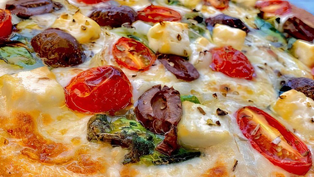 The Greek Pizza · Garlic infused olive oil, cheese blend, fresh spinach, kalamata olives, feta cheese, tomatoes, and onions.
