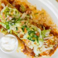Burrito Fiesta · Choice of shredded chicken, ground beef, or pork burrito stuffed with Mexican rice and refri...