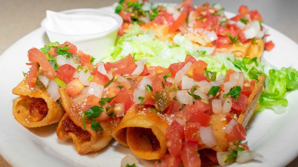 Taquitos · Shredded chicken rolled in corn tortillas, fried until crispy. Topped with salsa roja, pico de gallo, lettuce, sour cream and Parmesan cheese.