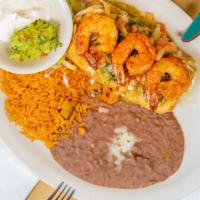 Seafood Chimichanga · Filled with a mix of shrimp, crab, scallops, fish, and vegetables. Topped with salsa verde a...