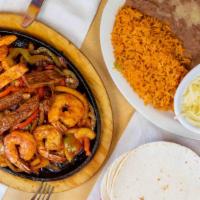 Supreme Fajitas · Get all three meats; grilled chicken, grilled steak, and shrimp.