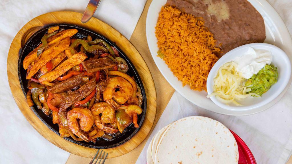 Supreme Fajitas · Get all three meats; grilled chicken, grilled steak, and shrimp.