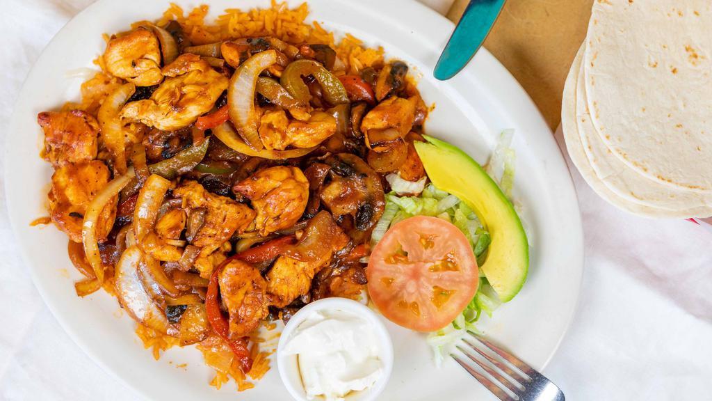 Arroz Con Pollo · Chicken breast strips sautéed in a mild tomato sauce with onions, bell peppers, and mushrooms. Served over a bed of Mexican rice with melted Cheddar cheese. Topped with avocado and sour cream.