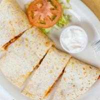 Grilled Chicken Quesadilla · Tender grilled chicken breast seasoned and cooked to perfection.