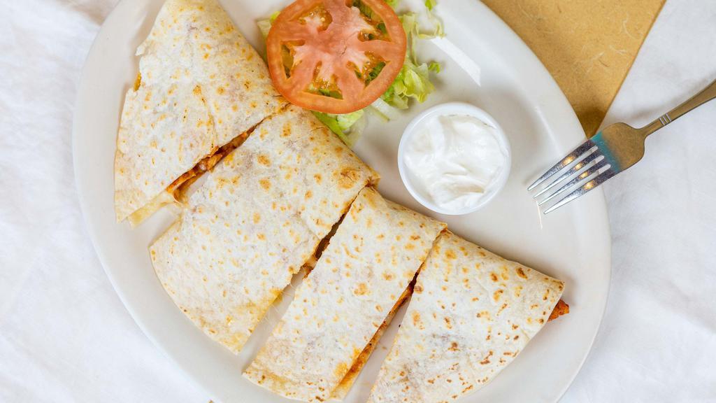 Grilled Chicken Quesadilla · Tender grilled chicken breast seasoned and cooked to perfection.