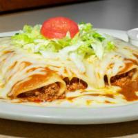 Fiesta Enchiladas · Four enchiladas, one of each: ground beef, shredded chicken, white Cheddar cheese, and refri...