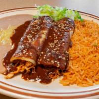 Mole Enchiladas · Contains peanuts. Two corn tortillas stuffed with shredded chicken, and topped with house-ma...