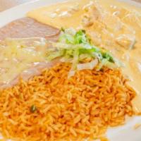 Pollo Con Crema · Tender chicken strips cooked with sour cream, Parmesan cheese and fiesta sauce, served with ...