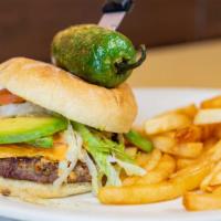 Southwest Burger · Served with avocado slices, lettuce, tomato, cheese, onions, and fries. Topped with a house ...