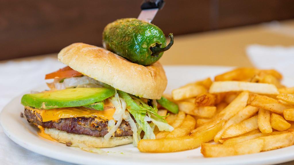 Southwest Burger · Served with avocado slices, lettuce, tomato, cheese, onions, and fries. Topped with a house made chipotle mayo and a grilled jalapeño.