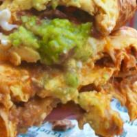 Super Pollo · Grilled chicken, pico de gallo, avocado crema, shoestring plantains. served on a hand-made c...