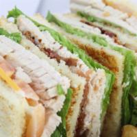 Turkey Club Sandwich · Freshly made with cheese, bacon, lettuce, tomato, and mayonnaise.