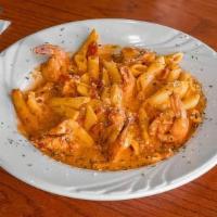 Penne Vodka · Penne pasta tossed in a delightful vodka creme sauce with diced tomato and sautéed onions.