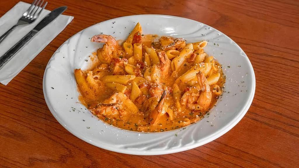 Penne Vodka · Penne pasta tossed in a delightful vodka creme sauce with diced tomato and sautéed onions.