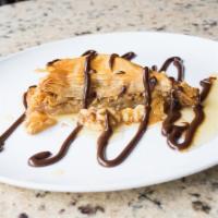 Baklava · Vegetarian. Walnuts and almonds, in layers of filo dough and topped with honey.