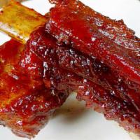Barbecued Spare Ribs · A cut of meat from the bottom section of the ribs that have been broiled roasted or grilled.
