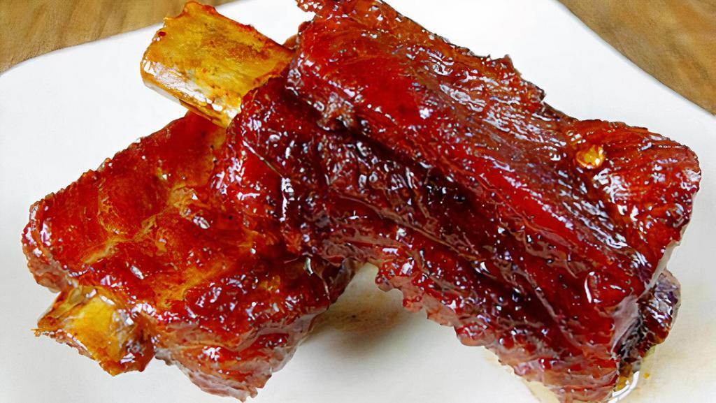 Barbecued Spare Ribs · A cut of meat from the bottom section of the ribs that have been broiled roasted or grilled.