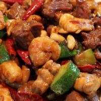 H 6. Kung Pao Three Delights · Hot & spicy. Tender beef cooked with chicken and jumbo shrimp in spicy Szechuan sauce with p...
