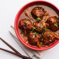 Vegetarian Manchurian · Veteable fritters and  Indian sauces to create a nice gravy