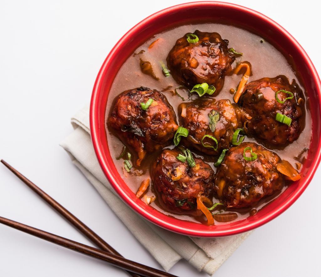 Vegetarian Manchurian · Veteable fritters and  Indian sauces to create a nice gravy