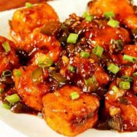 Paneer Manchurian · Paneer Cubes deep fried and tossed with diced onions and chilli flakes.