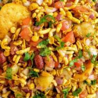 Bhel Puri · A savory snack made of puffed rice, vegetables, and a mix of chutneys.