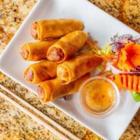 Thai Spring Rolls · Popular crispy spring roll, wrapped with chicken, vegetable, chopped scallions and coriander...