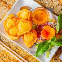 Crab Rangoon · Homemade wonton filled with cream cheese, chopped crab meat, and onion. Served with house sp...