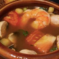 Tom Yum Goong Soup · Spicy.  The famous sour and spicy shrimp soup seasoned with lemongrass, lime juice, mushroom...