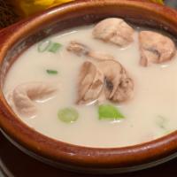 Tom Kar Gai Soup · Tender chicken in coconut milk soup seasoned with galangal, lime juice, baby corn and mushro...