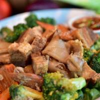 Pad See Ew · Wide rice noodles, broccoli, carrots and egg, stir-fried with your choice of meat.
