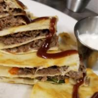 Cheesesteak Quesadilla · Shaved ribeye, caramelized onions and peppers, provolone, fontina cheeses, flour tortillas, ...