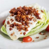 Blt Wedge Salad · Iceberg wedge, housemade blue cheese dressing, applewood smoked bacon, diced tomatoes