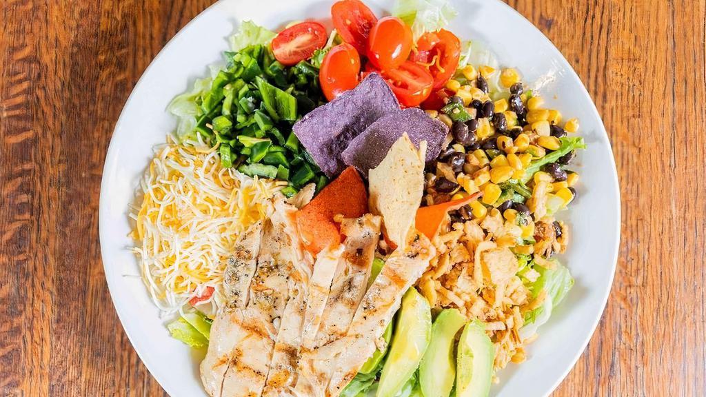 Southwestern Cobb Salad · Mixed greens, chicken breast, sliced avocado,diced tomato, poblano peppers, black bean and corn relish, Monterey jack and cheddar	cheese, onion rings, housemade ranch