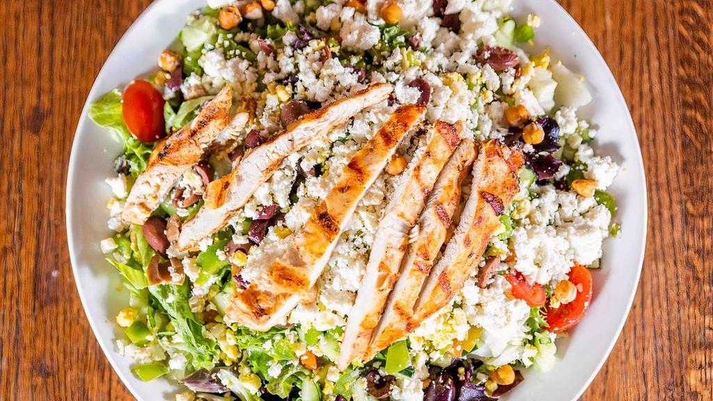 Greek Salad With Grilled Chicken · Mixed greens, grilled chicken, bell peppers, Kalamata olives, tomatoes, egg, feta, cucumbers, red onion, crispy chickpeas, Greek feta vinaigrette