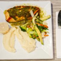 Salmao Ao Molho De Maracuja · Grilled Salmon Filet in a Passion Fruit Sauce, Served with Mashed Potato and sauteed mix veg...
