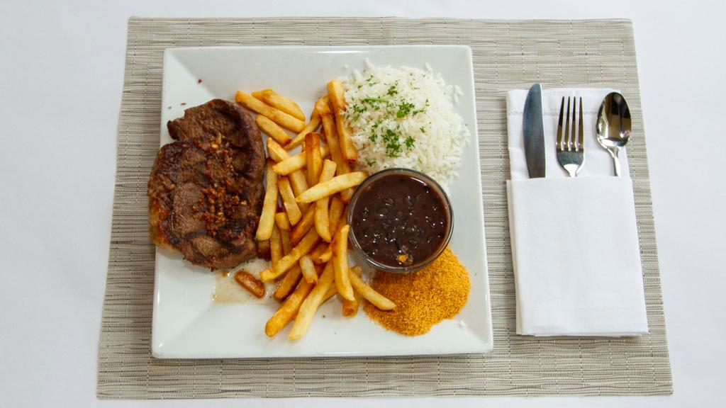 Picanha Grelhada · Grilled beef steak served with rice, black beans, and fresh vinaigrette sauce. Choose one side sauteed collard greens, mixed sautéed vegetable or French fries.