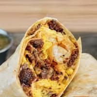 Breakfast Burrito · Flour Tortilla filled with scrambled eggs, sausage, peppers, onions and cheese, side of home...