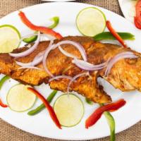 Fried Fish (Poisson Fri) · Sniper fish or king fish served with choice of rice, side and plantains
