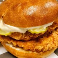 Chicken Sandwich · Fried Chicken Sandwich on a toasted Brioche bun, topped with pickles and Mayo